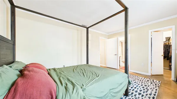 a bedroom with a bed and a walk in closet