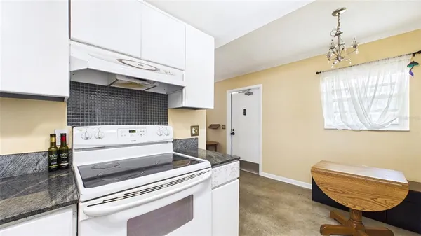 a room with furniture and a flat screen tv