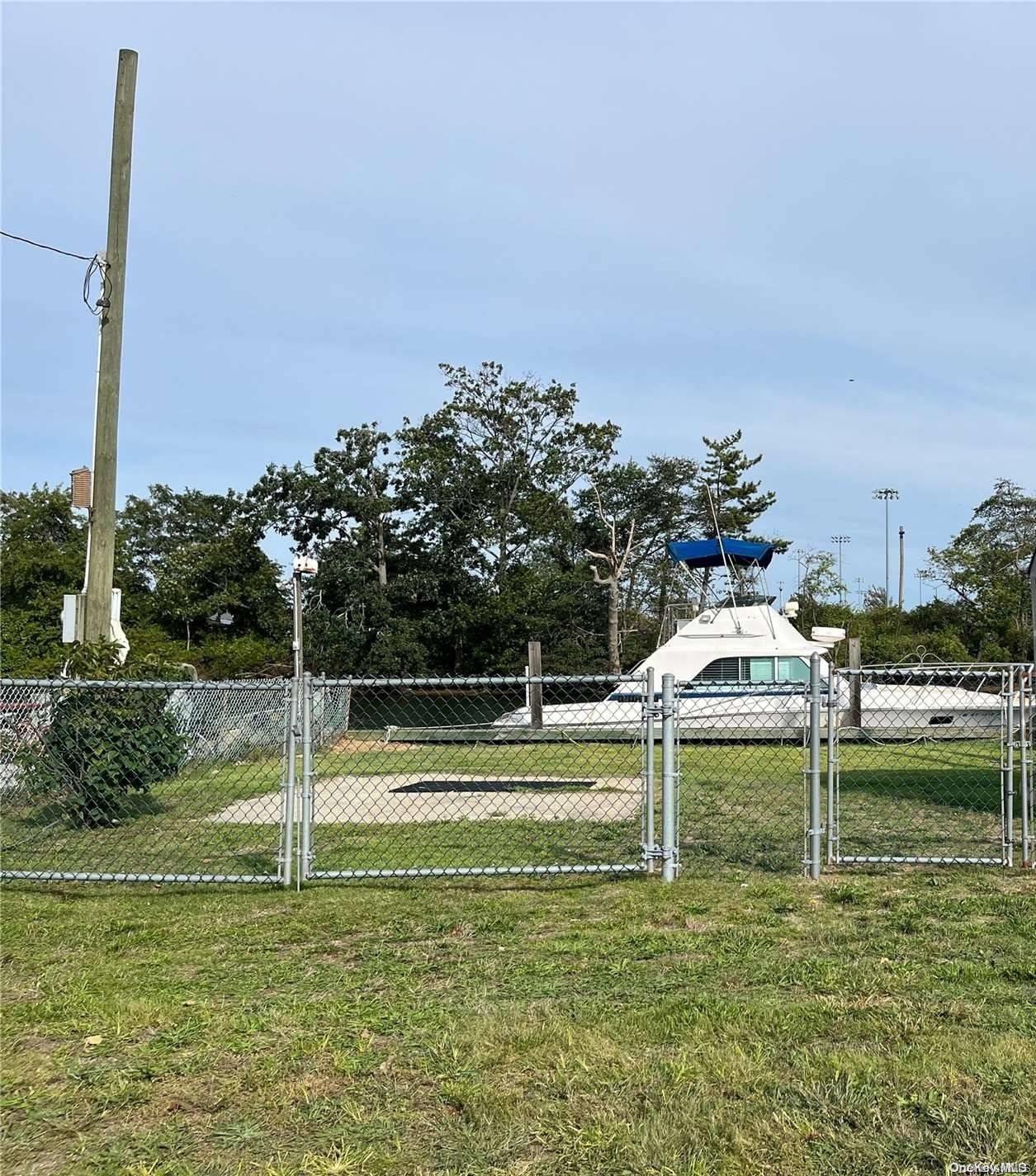 a swimming pool with outdoor seating and yard