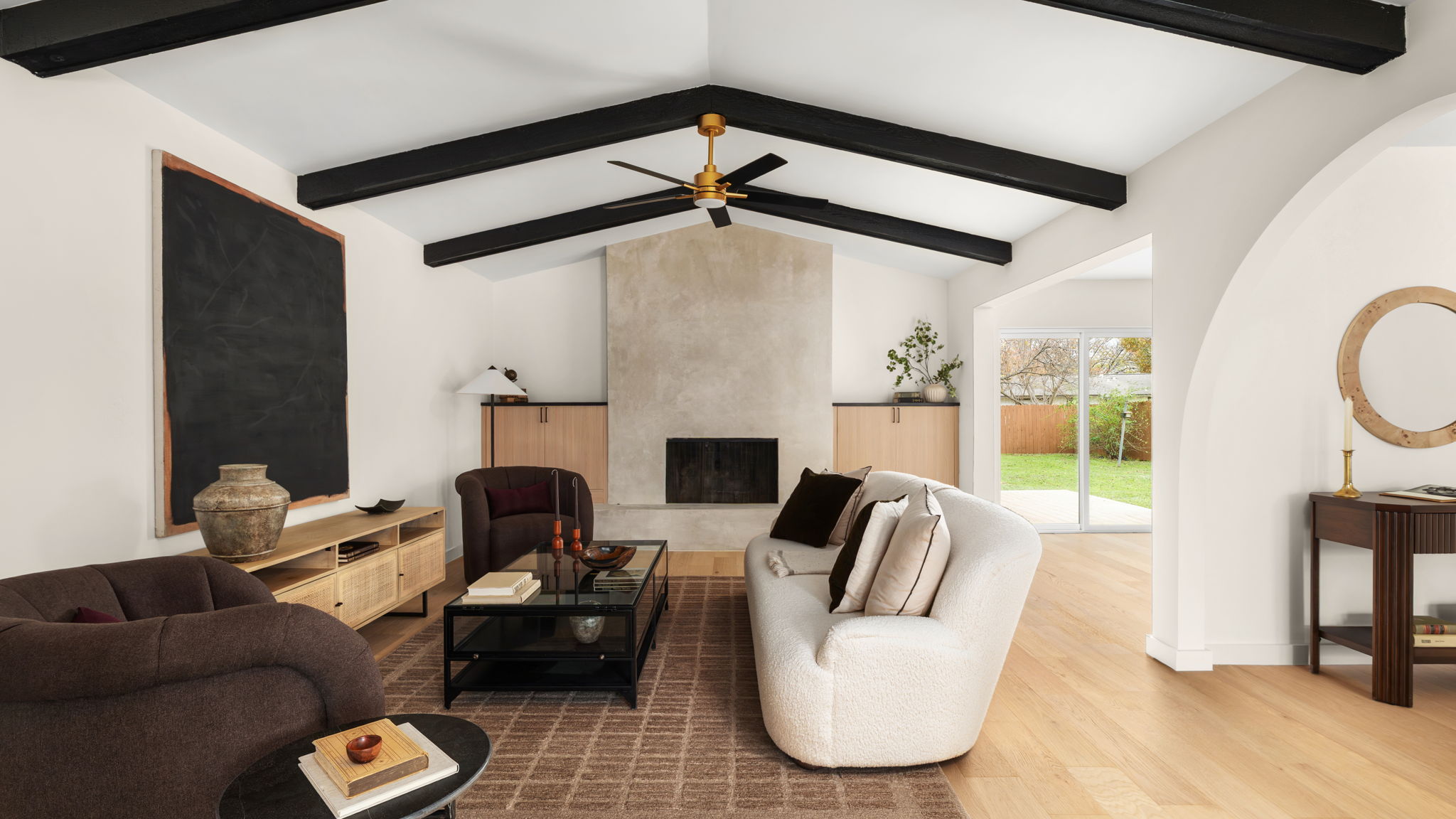 Beautiful high beamed ceiling and arched wall.