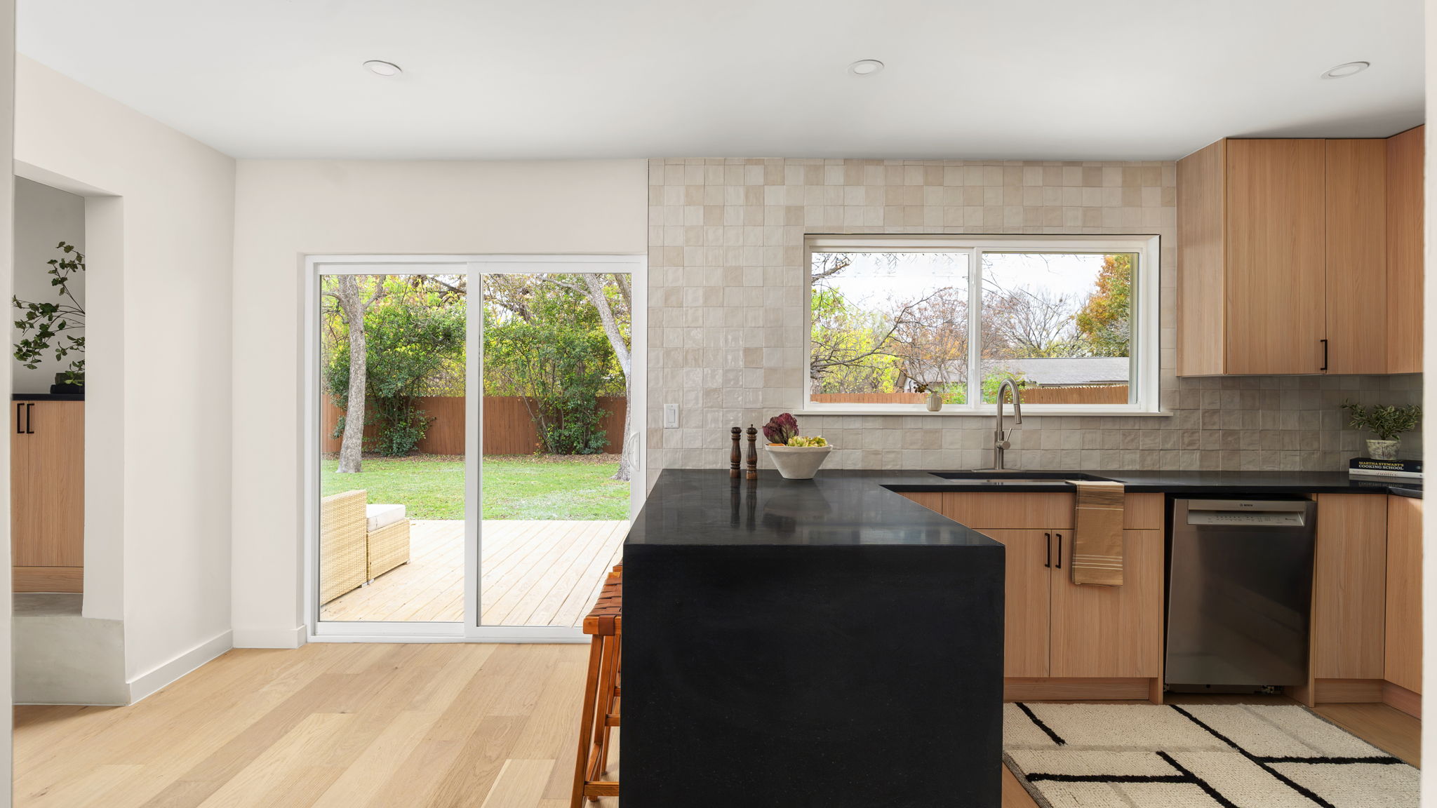 3101 Val Drive Austin, TX 78723 - Photo 20 of 40 a kitchen with granite countertop a stove a sink and a next to a window