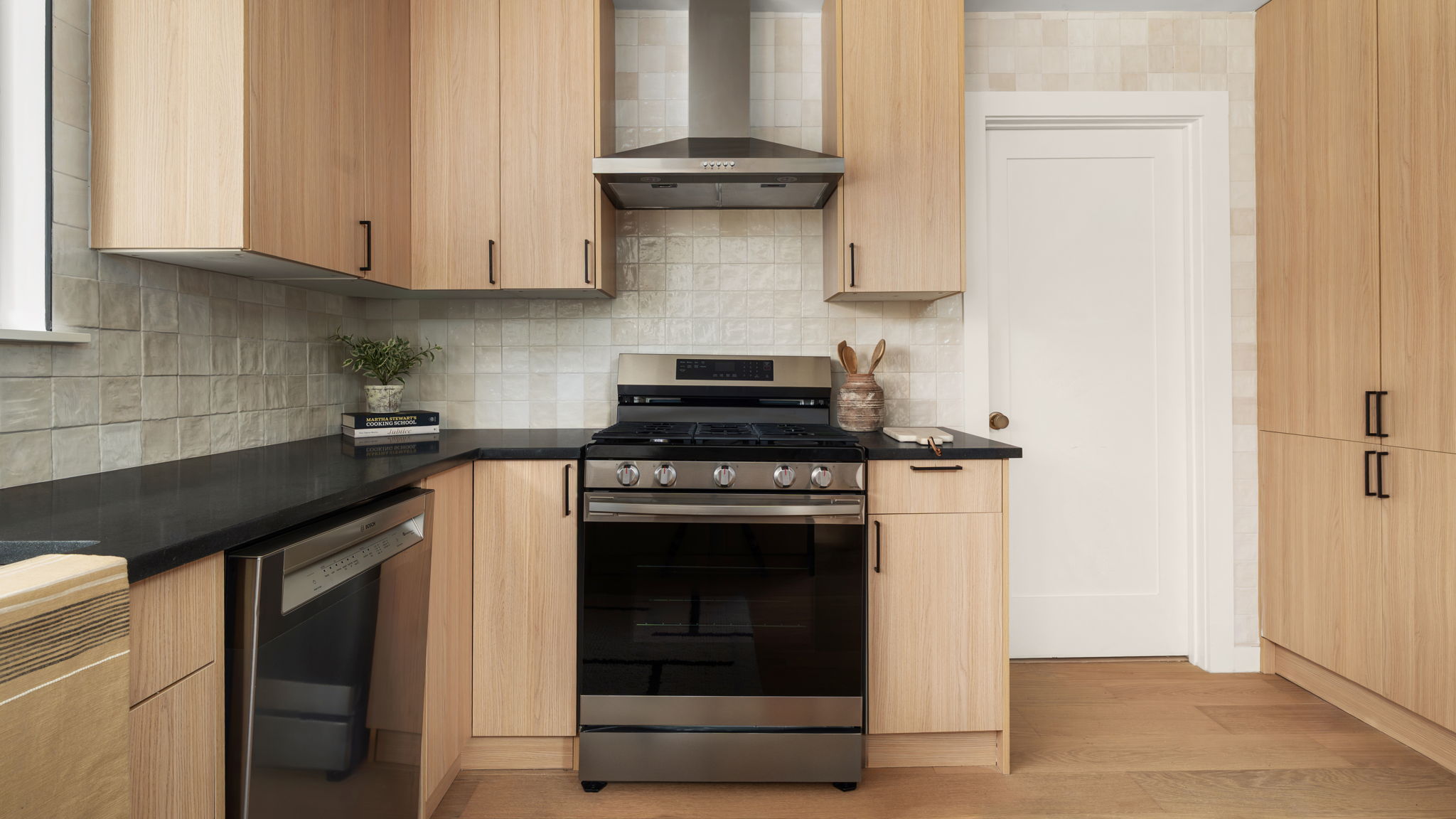 3101 Val Drive Austin, TX 78723 - Photo 23 of 40 a kitchen with stainless steel appliances granite countertop white cabinets and a stove