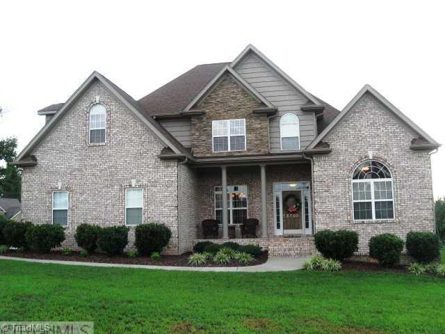 5703 Mabe Drive Oak Ridge, NC 27310 - Photo 1 of 15 Exterior Front.