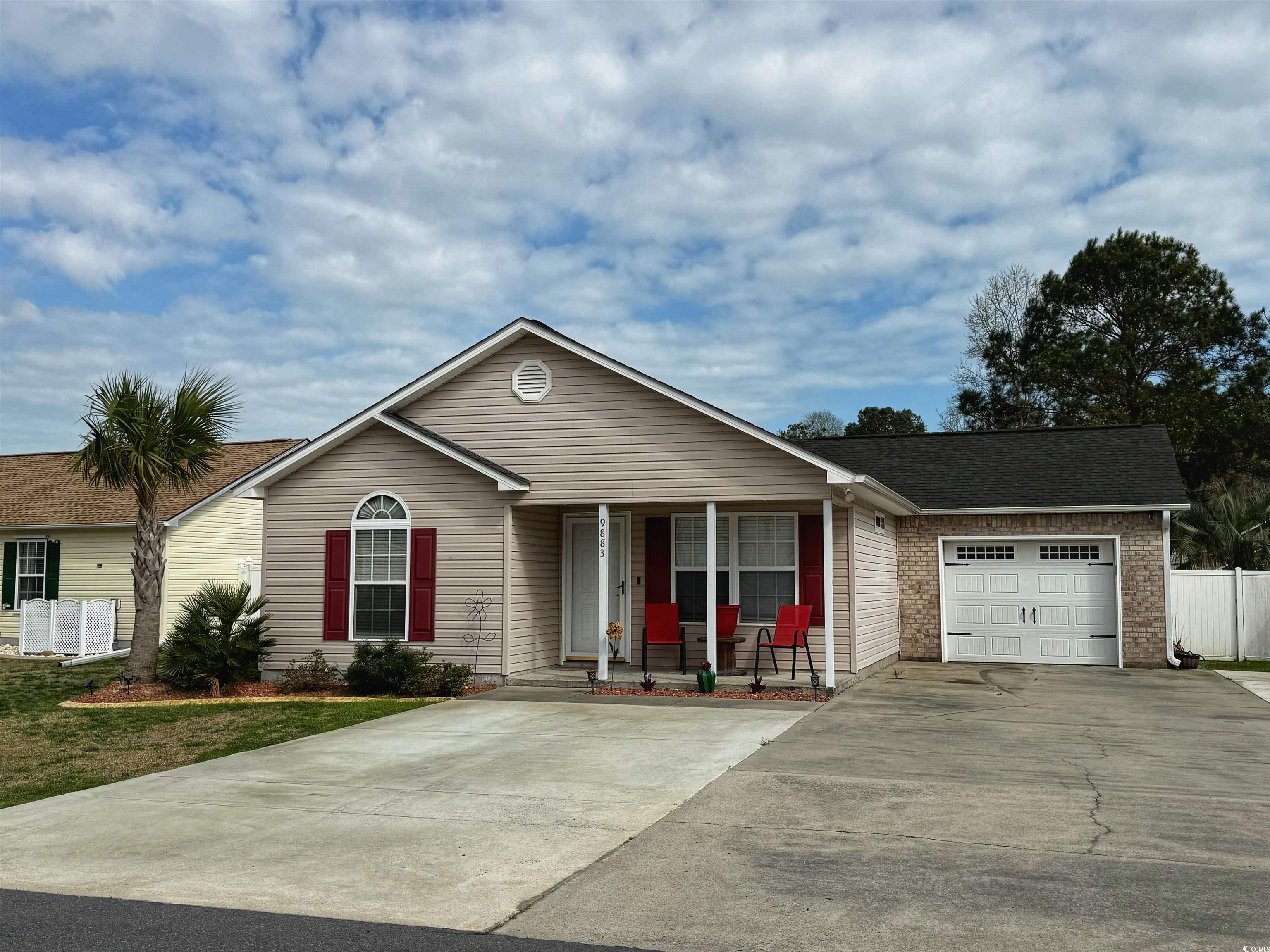 9883 Conifer Lane Murrells Inlet, SC 29576 - Photo 1 of 24 Ranch-style home with covered porch, an attached g