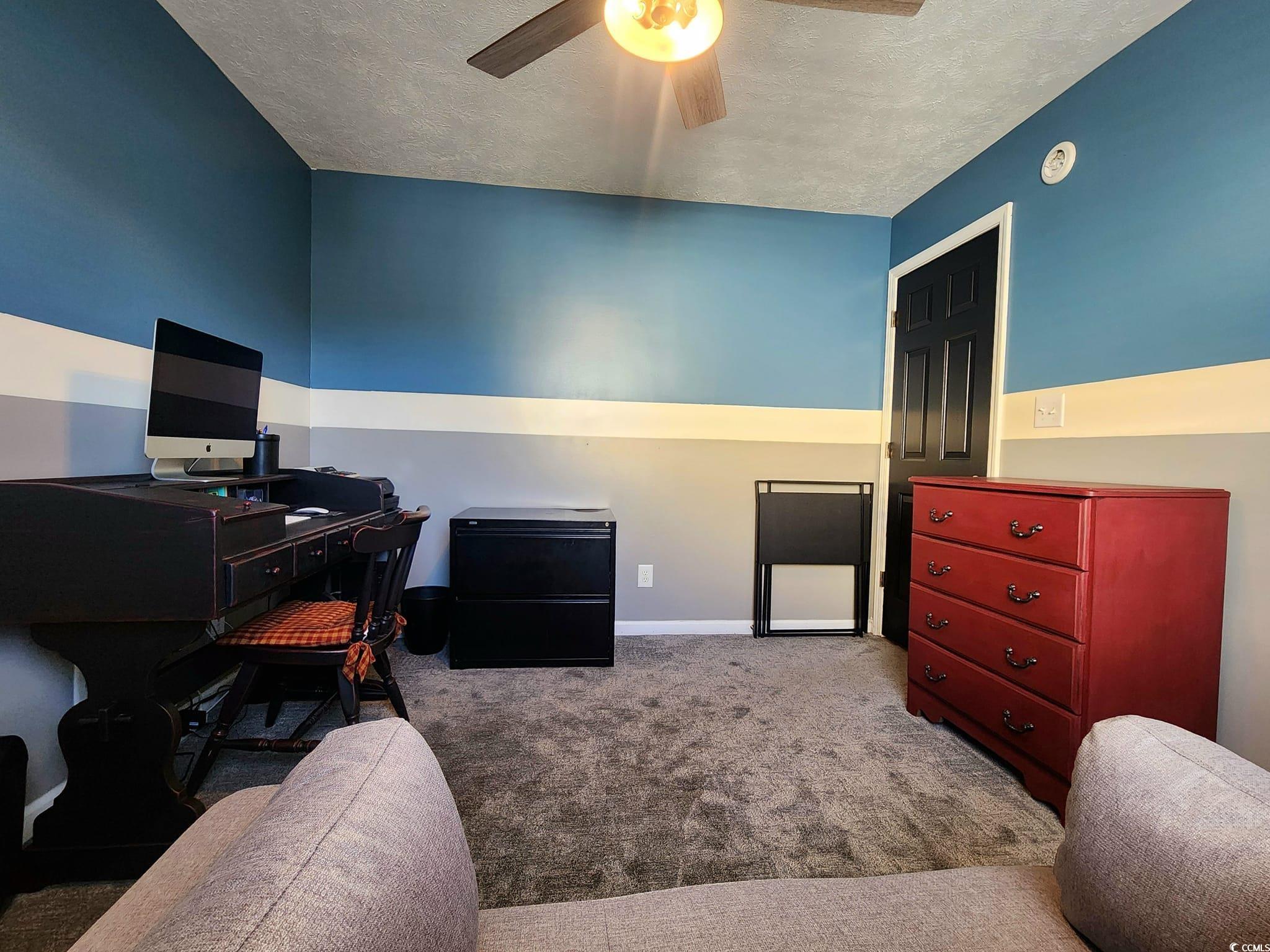 9883 Conifer Lane Murrells Inlet, SC 29576 - Photo 17 of 24 Carpeted bedroom featuring baseboards, a textured