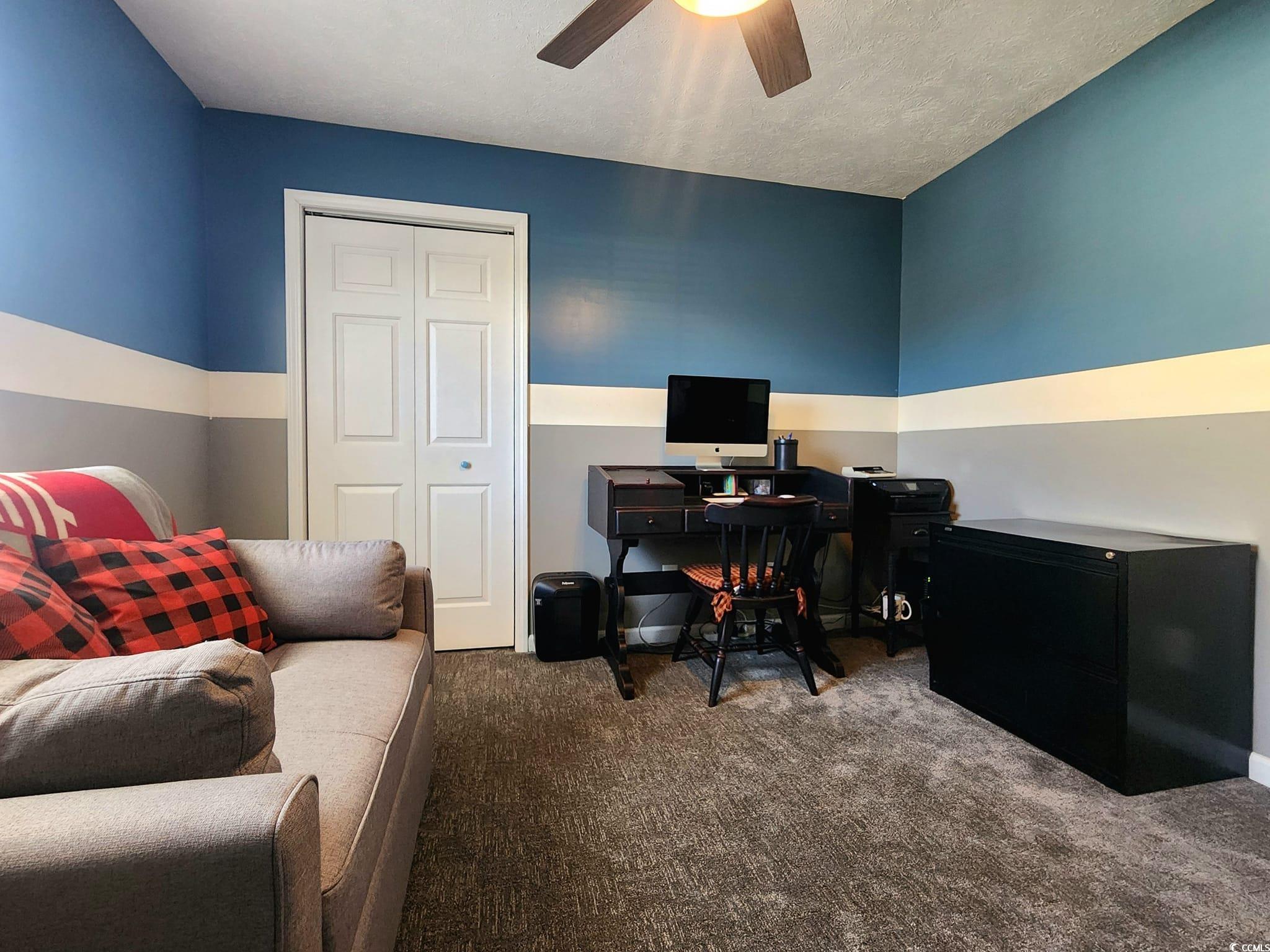 9883 Conifer Lane Murrells Inlet, SC 29576 - Photo 18 of 24 Carpeted office space with a ceiling fan and a tex