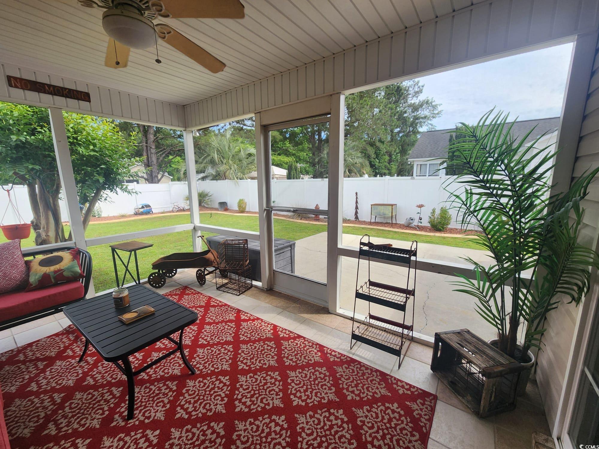 9883 Conifer Lane Murrells Inlet, SC 29576 - Photo 22 of 24 Sunroom featuring a ceiling fan and a wealth of na