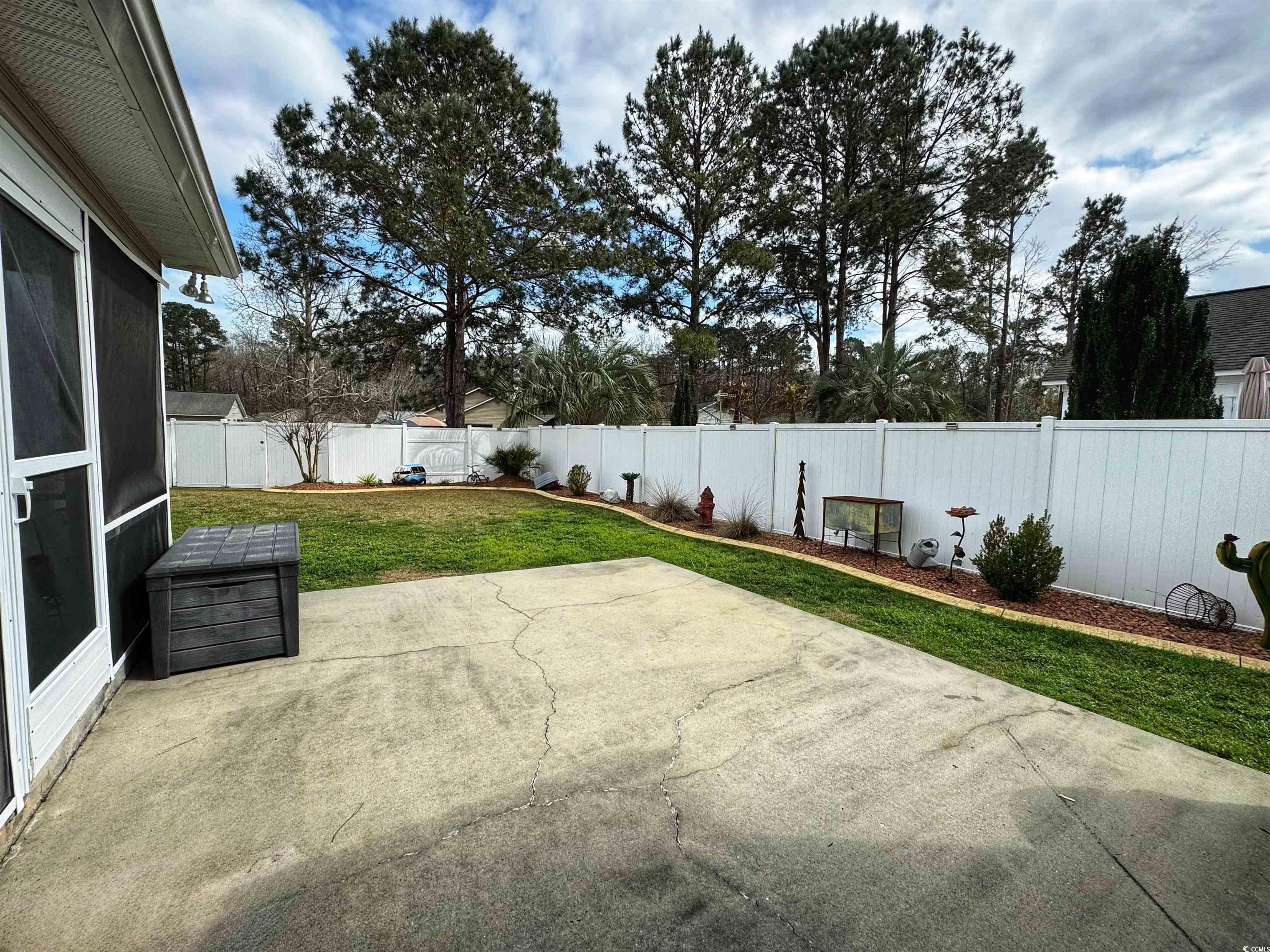 9883 Conifer Lane Murrells Inlet, SC 29576 - Photo 23 of 24 View of patio / terrace with a fenced backyard