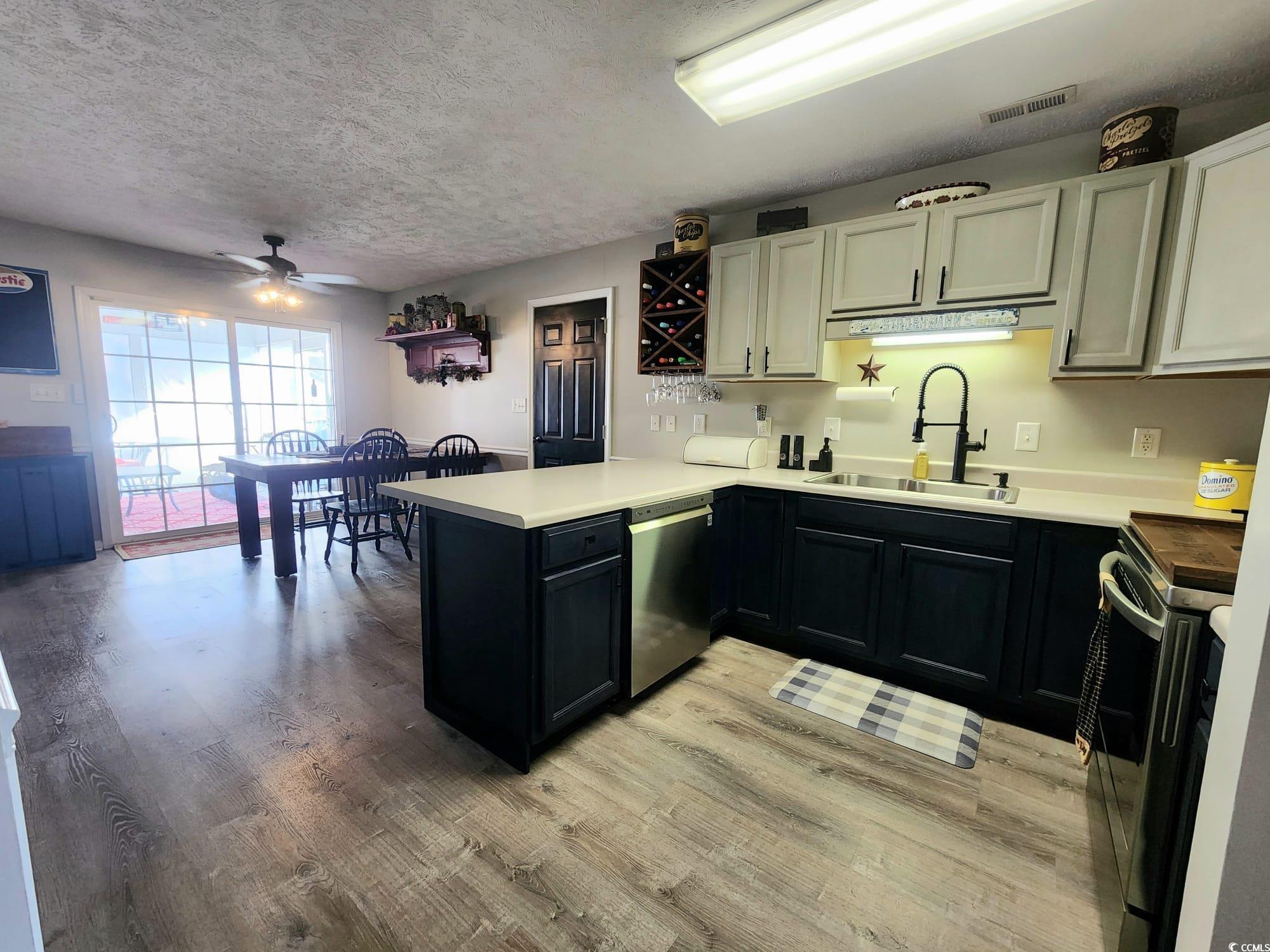 9883 Conifer Lane Murrells Inlet, SC 29576 - Photo 5 of 24 Kitchen with visible vents, ceiling fan, appliance