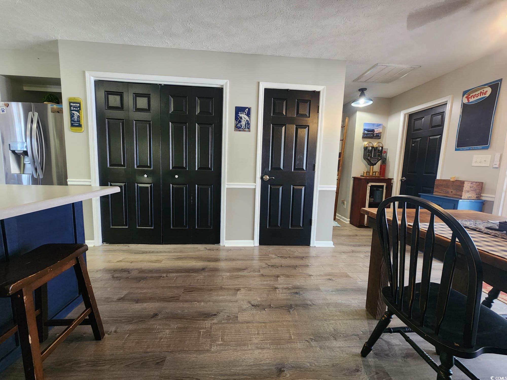 9883 Conifer Lane Murrells Inlet, SC 29576 - Photo 8 of 24 Dining area featuring visible vents, baseboards, a