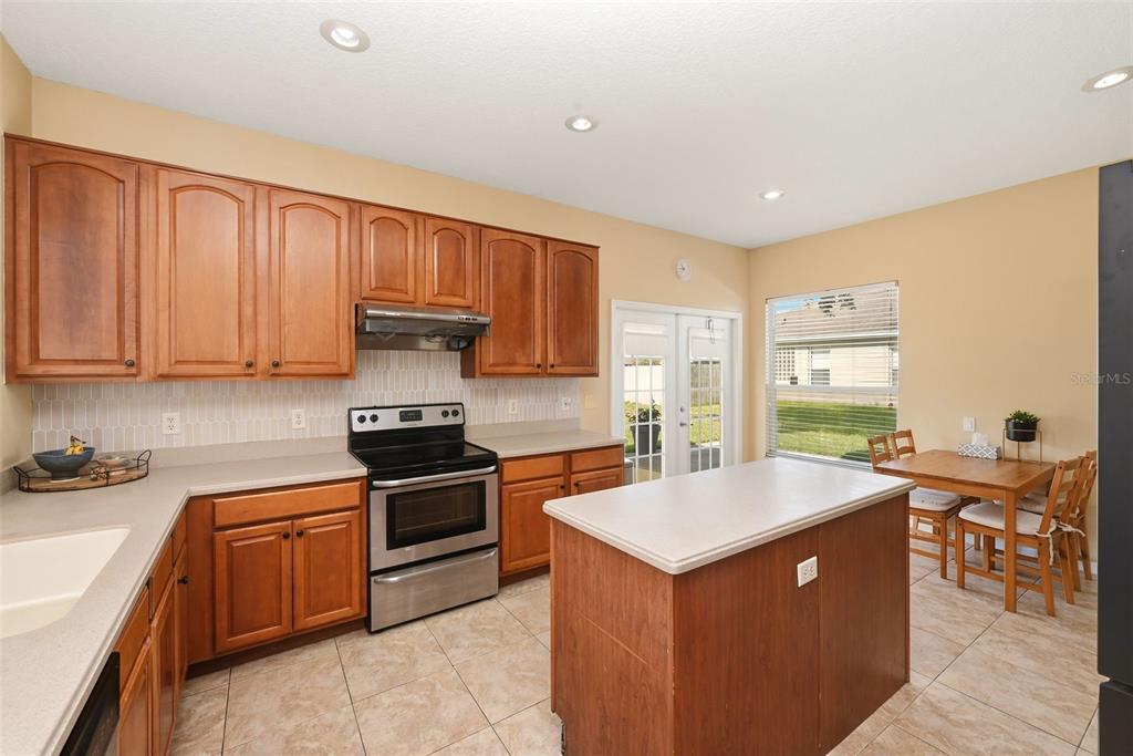 936 Kingsridge Circle Gotha, FL 34734 - Photo 8 of 50 a kitchen with a sink stove and cabinets