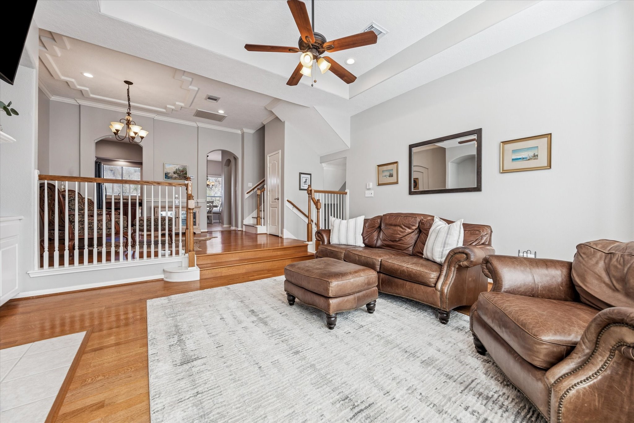 1802 Stacy Falls Houston, TX 77008 - Photo 3 of 21 Opposite view of living area (from windows) looking toward the dining room and through arched doorways into kitchen.
