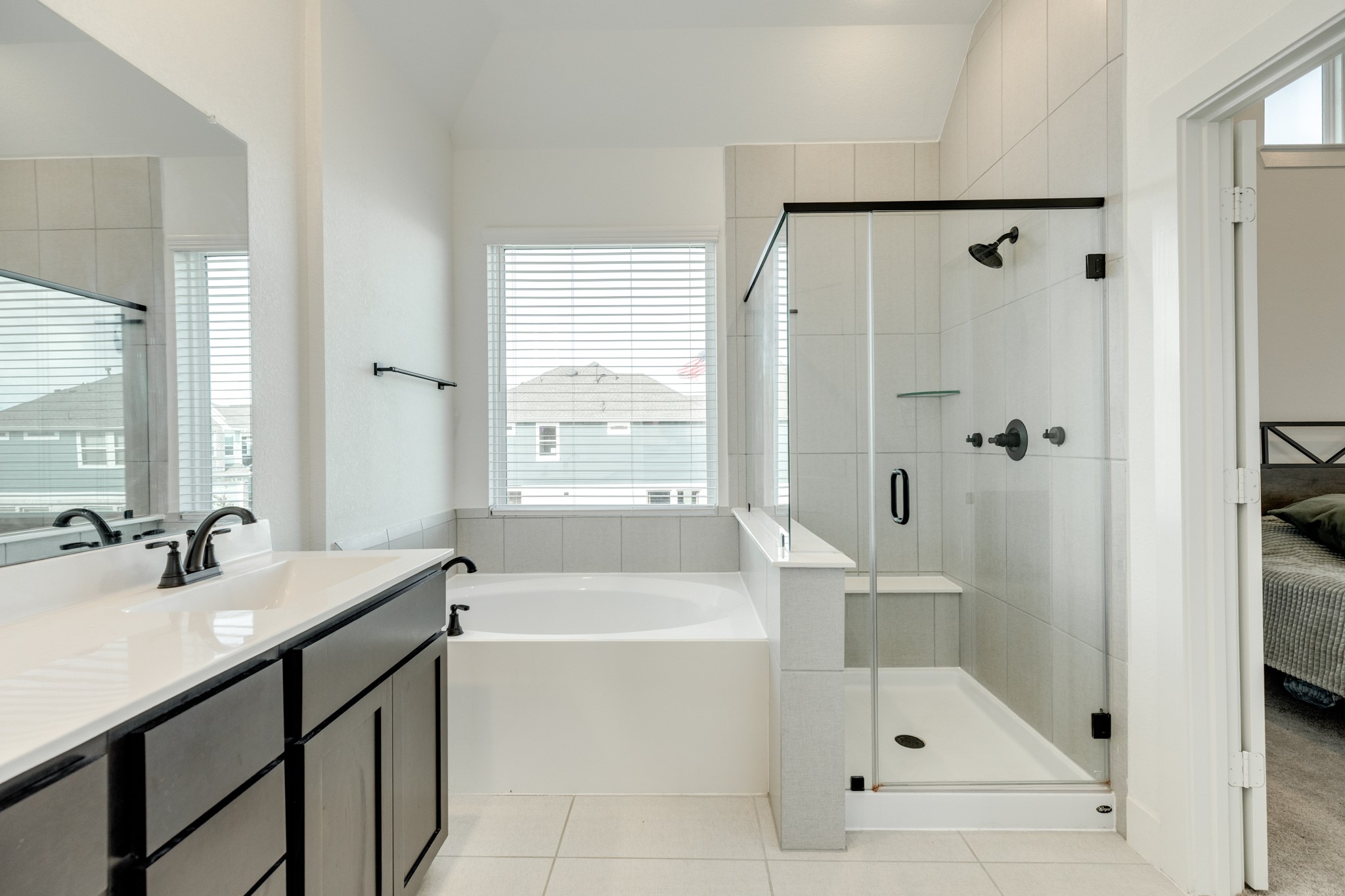 10002 Nectar Path Rosharon, TX 77583 - Photo 21 of 46 The soaking tub features a window, allowing for ample natural light.