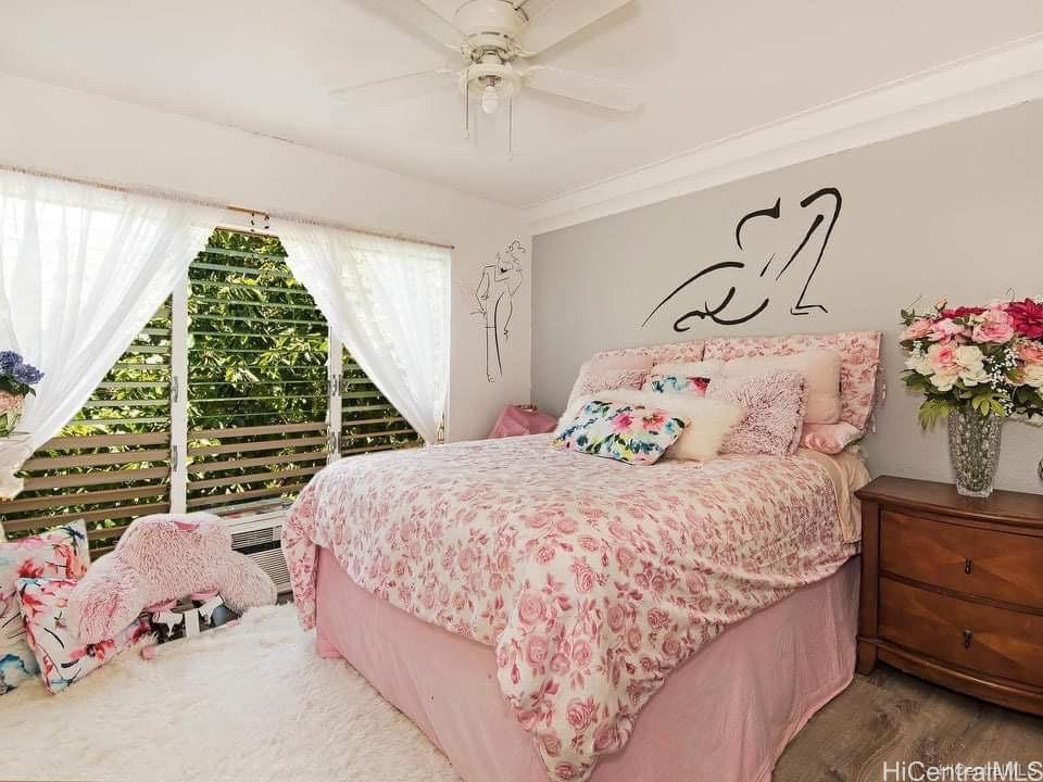 68-101 Waialua Beach Road, Unit 302 Waialua, HI 96791 - Photo 1 of 1 a bedroom with a bed and a window