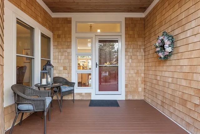 a view of a livingroom with furniture and an entrance