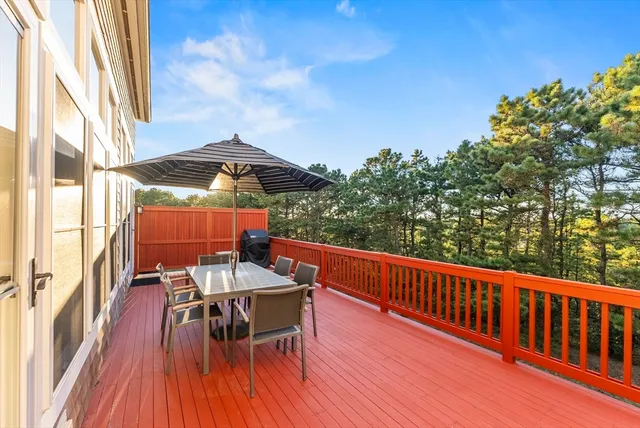 a view of balcony with furniture and wooden floor