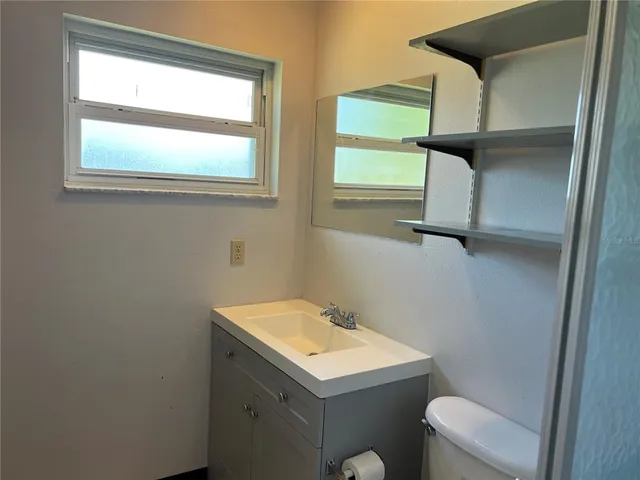 a bathroom with a sink and a toilet