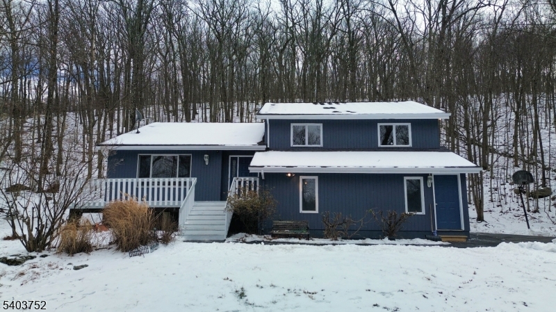 118 Statesville Quarry Road Lafayette, NJ 07848 - Photo 1 of 19 a front view of a house with a yard covered in snow