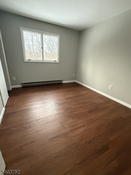 118 Statesville Quarry Road Lafayette, NJ 07848 - Photo 17 of 19 an empty room with wooden floor and windows