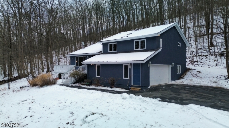 118 Statesville Quarry Road Lafayette, NJ 07848 - Photo 3 of 19 a view of a house with a yard covered in snow