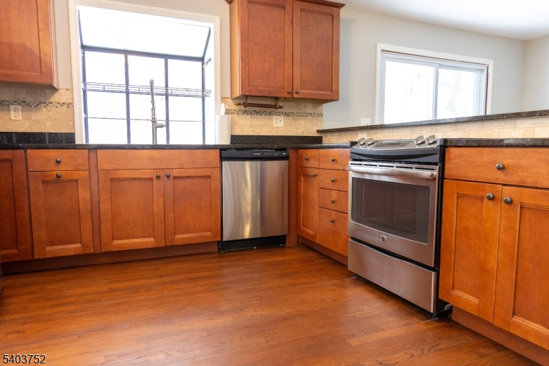 118 Statesville Quarry Road Lafayette, NJ 07848 - Photo 6 of 19 a kitchen with granite countertop cabinets stainless steel appliances and a window