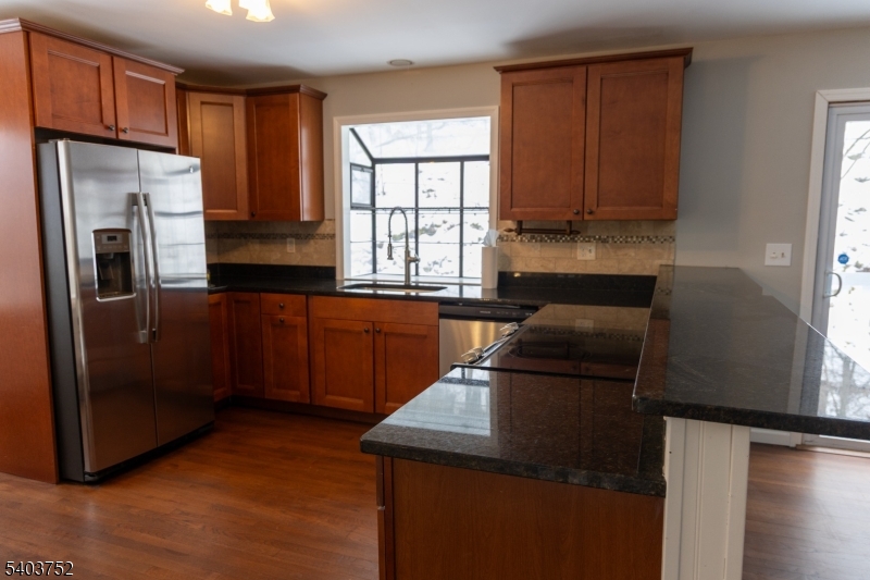 118 Statesville Quarry Road Lafayette, NJ 07848 - Photo 8 of 19 a kitchen with a refrigerator and a sink