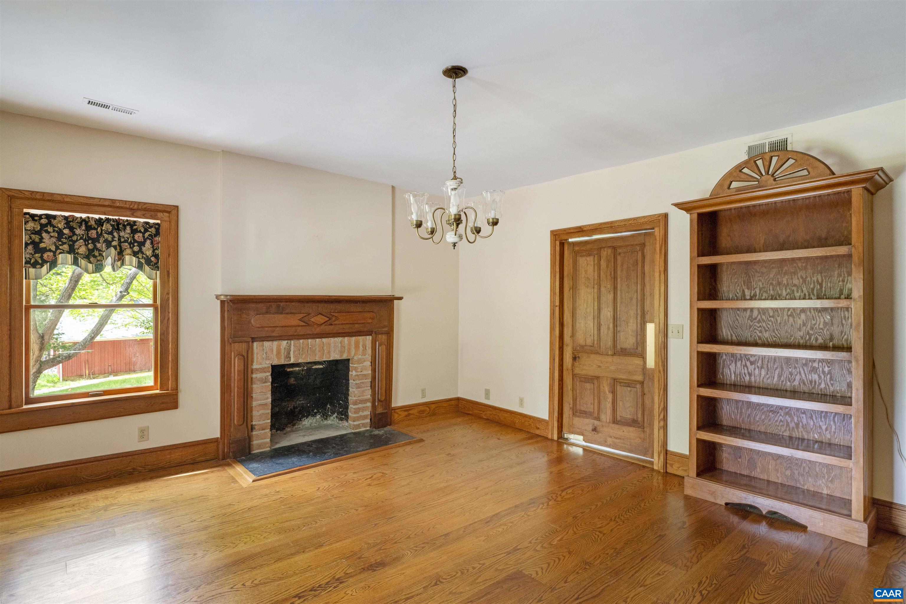 1888 Craigs Store Road Afton, VA 22920 - Photo 15 of 73 a view of an empty room with a fireplace and a window