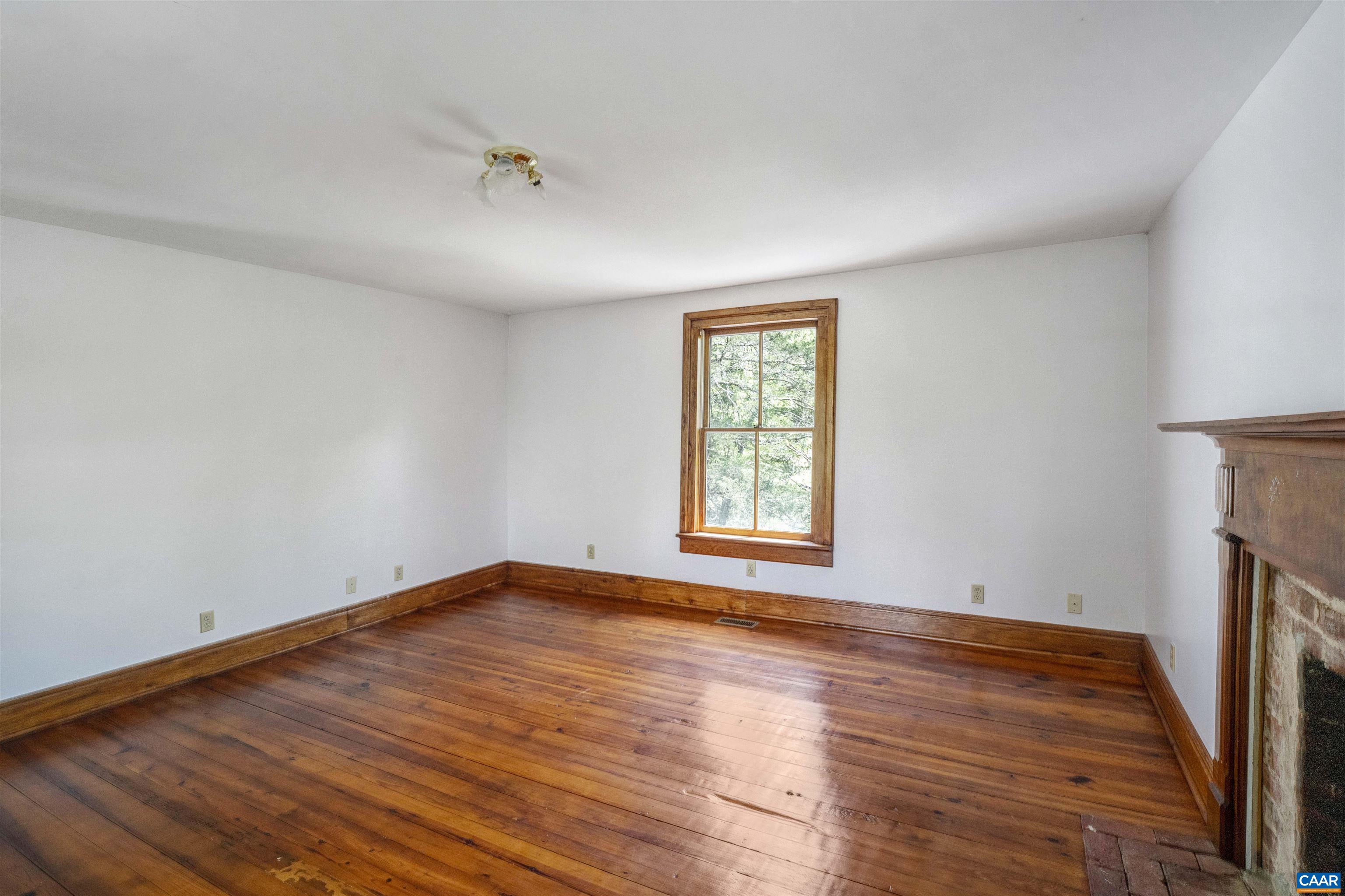1888 Craigs Store Road Afton, VA 22920 - Photo 28 of 73 wooden floor in an empty room with a window