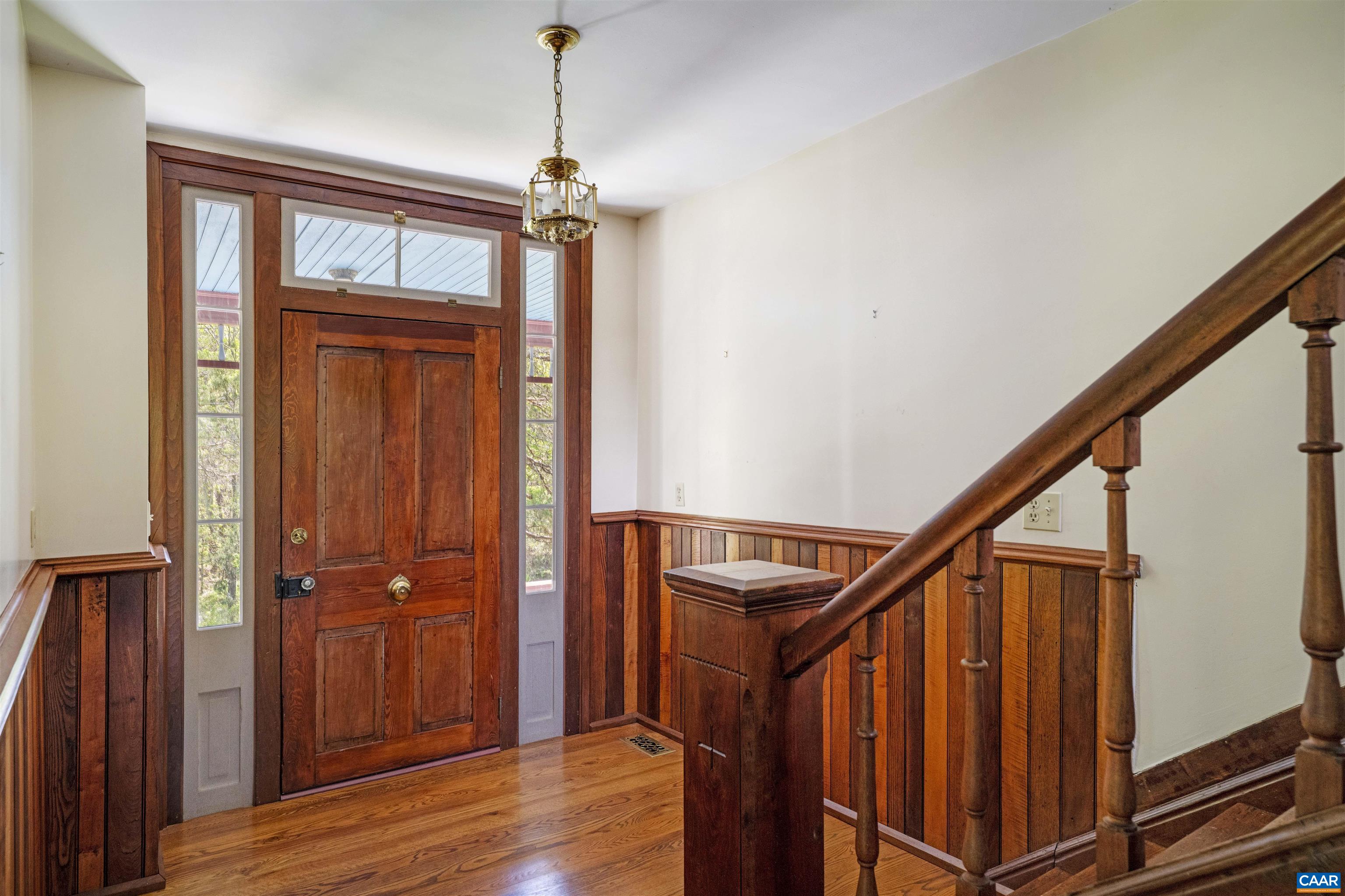 1888 Craigs Store Road Afton, VA 22920 - Photo 5 of 73 a view of a hallway with wooden floor and staircase