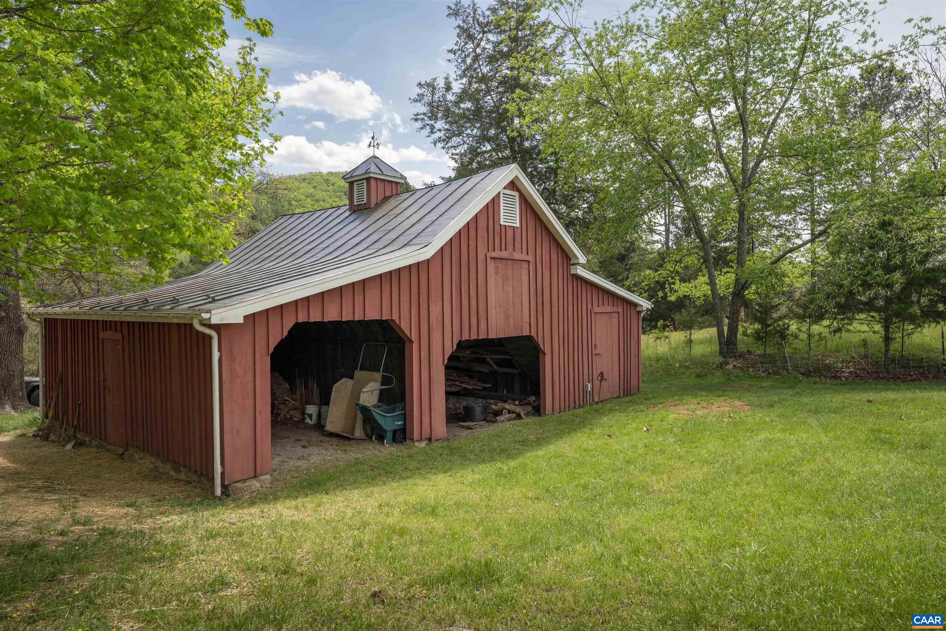 1888 Craigs Store Road Afton, VA 22920 - Photo 8 of 73 a view of a small barn with large trees