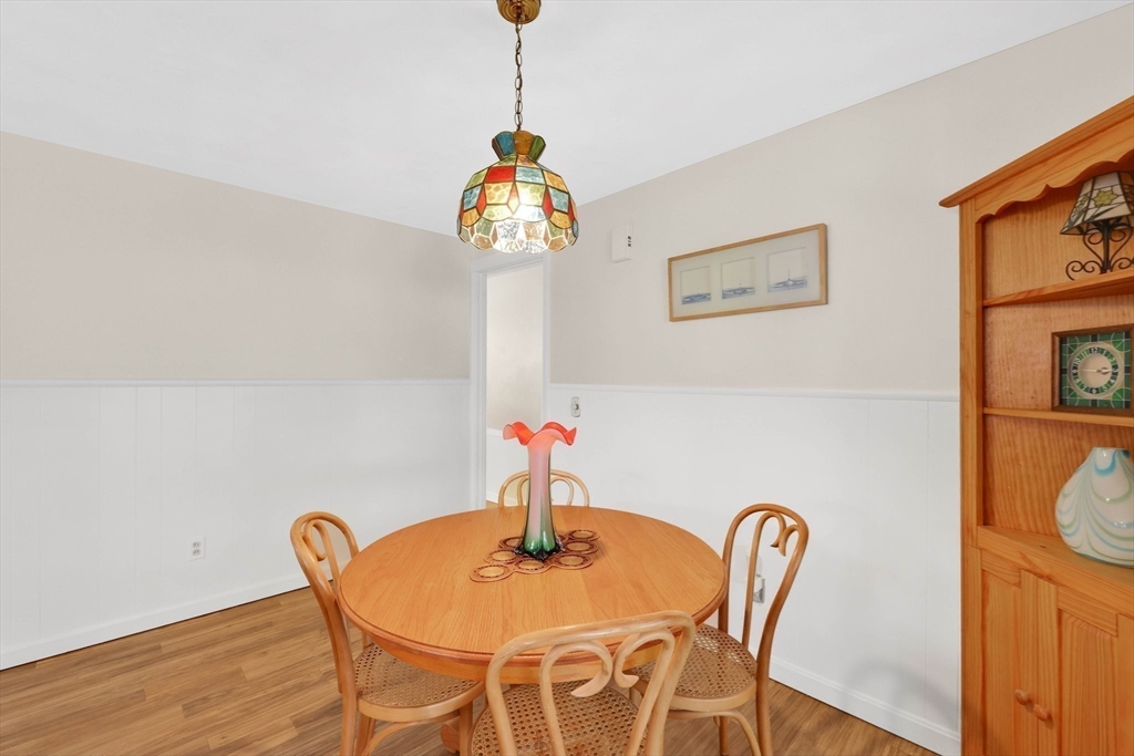 76 Regal Street Springfield, MA 01118 - Photo 12 of 38 a view of a dining room with furniture and wooden floor