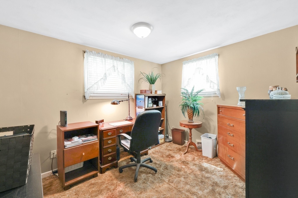 76 Regal Street Springfield, MA 01118 - Photo 19 of 38 a room with furniture and a window