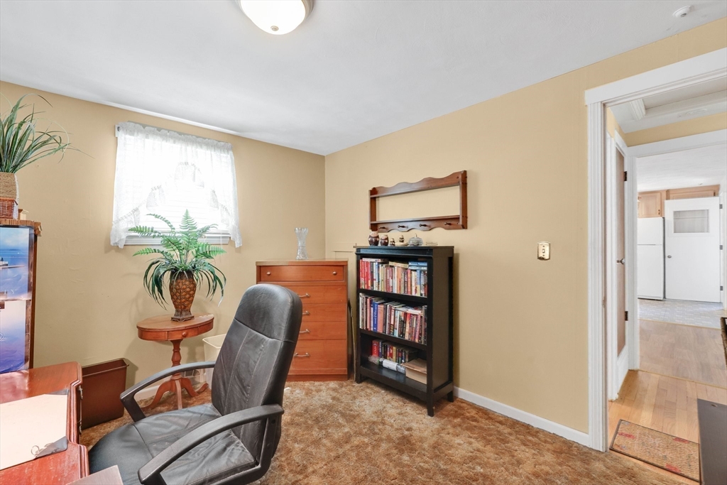 76 Regal Street Springfield, MA 01118 - Photo 20 of 38 a view of a workspace with furniture and a window