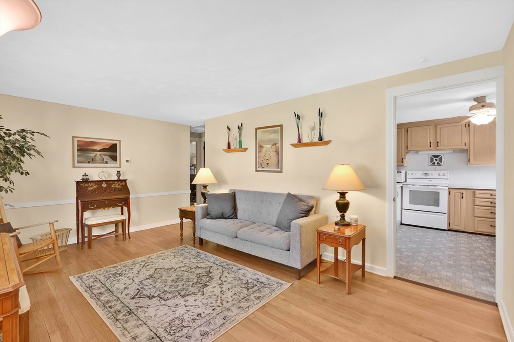 76 Regal Street Springfield, MA 01118 - Photo 3 of 38 a living room with furniture and a wooden floor