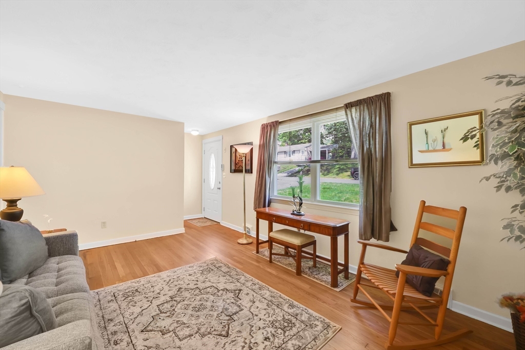 76 Regal Street Springfield, MA 01118 - Photo 4 of 38 a living room with furniture and a window