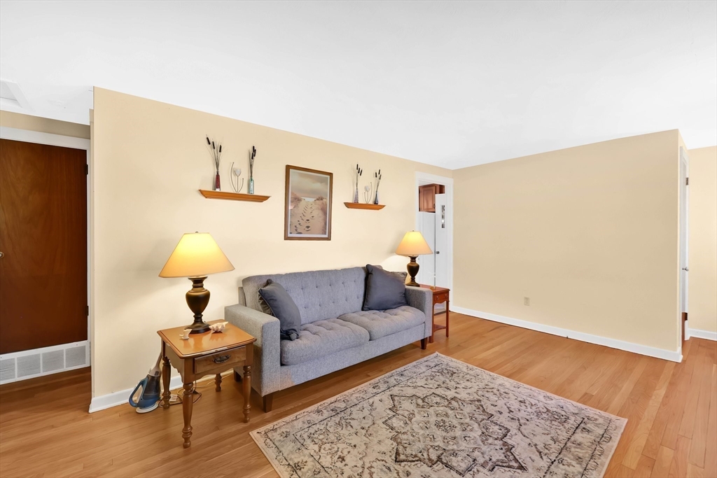 76 Regal Street Springfield, MA 01118 - Photo 5 of 38 a living room with furniture and a rug