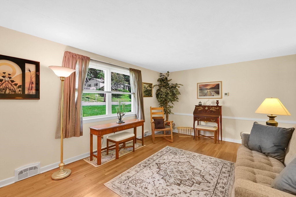 76 Regal Street Springfield, MA 01118 - Photo 6 of 38 a living room with furniture and a window