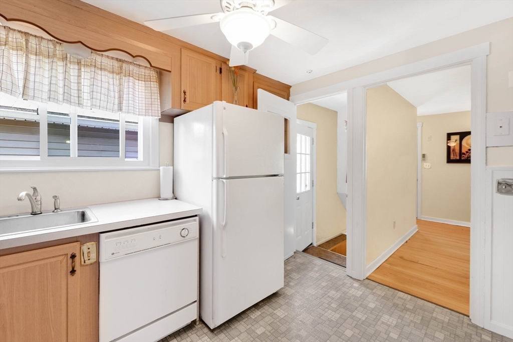 76 Regal Street Springfield, MA 01118 - Photo 7 of 38 a utility room with cabinets washer and dryer
