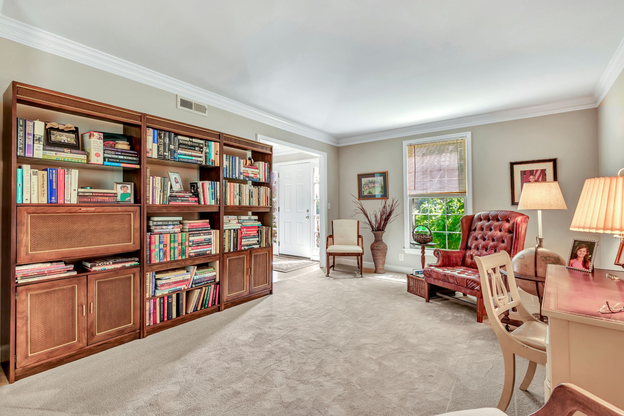 1327 General George Patton Road Nashville, TN 37221 - Photo 4 of 36 a living room with lots of furniture and a book shelf
