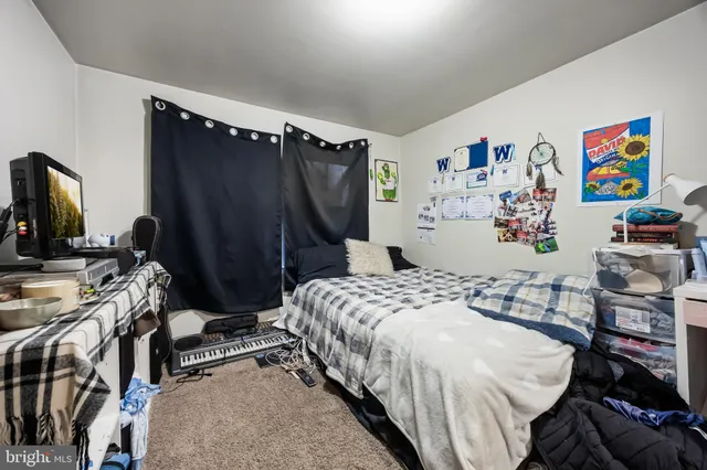 a bedroom with a bed and a walk in closet