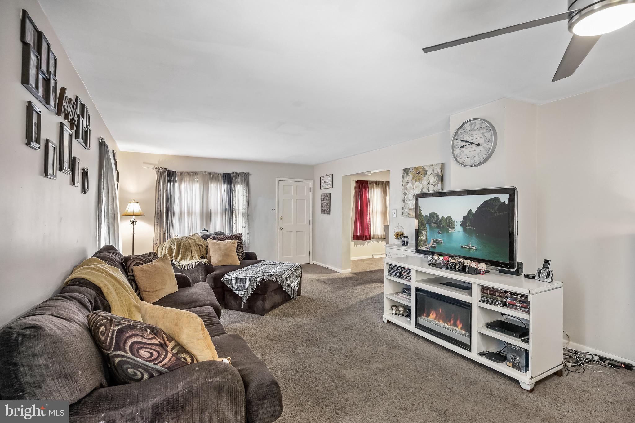 2276 Winslow Road Williamstown, NJ 08094 - Photo 3 of 39 a living room with furniture a flat screen tv and a window