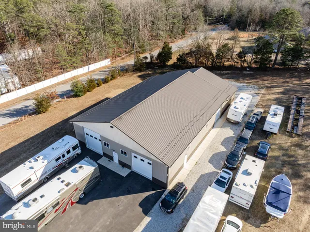 an aerial view of residential house with outdoor space