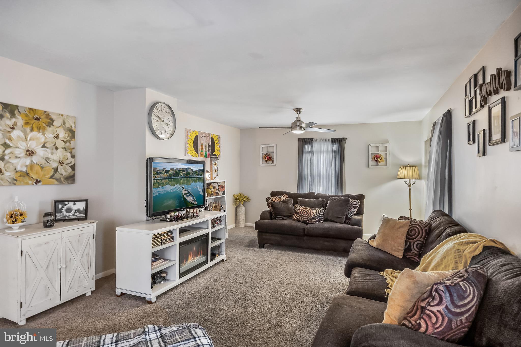 2276 Winslow Road Williamstown, NJ 08094 - Photo 7 of 39 a living room with furniture and a flat screen tv