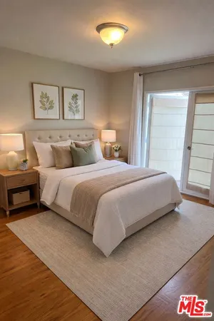 a bedroom with a bed and a lamp