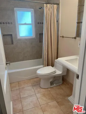 a bathroom with a toilet a sink and a bathtub