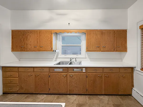 a kitchen with a sink and cabinets