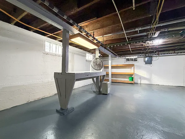 a view of a empty room with wooden floor