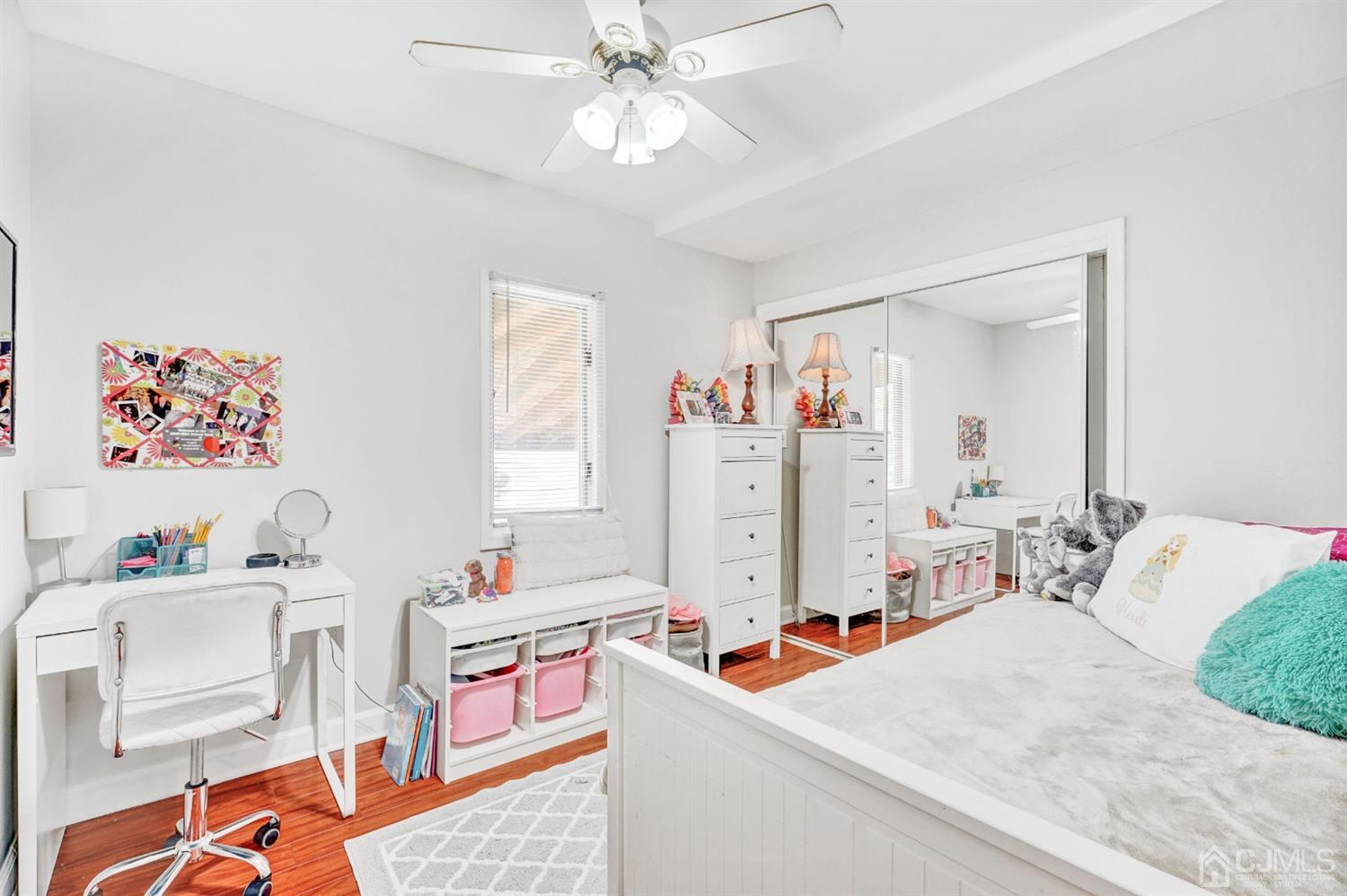 254 Manalapan Road Spotswood, NJ 08884 - Photo 19 of 41 a living room with furniture and a baby crib