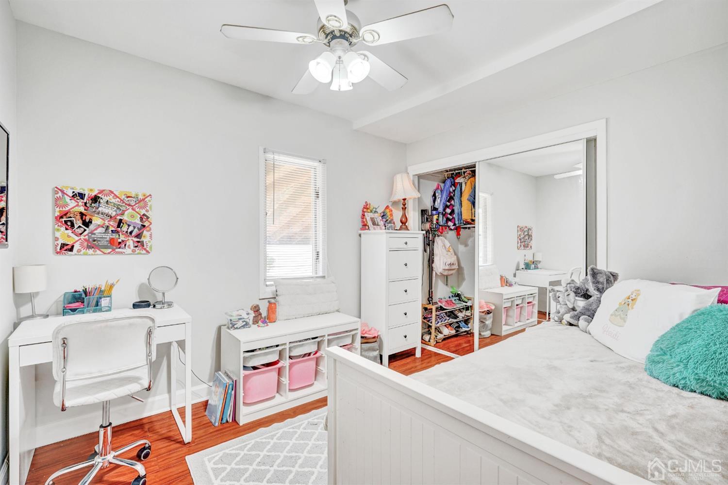 254 Manalapan Road Spotswood, NJ 08884 - Photo 20 of 41 a living room with furniture and a baby crib