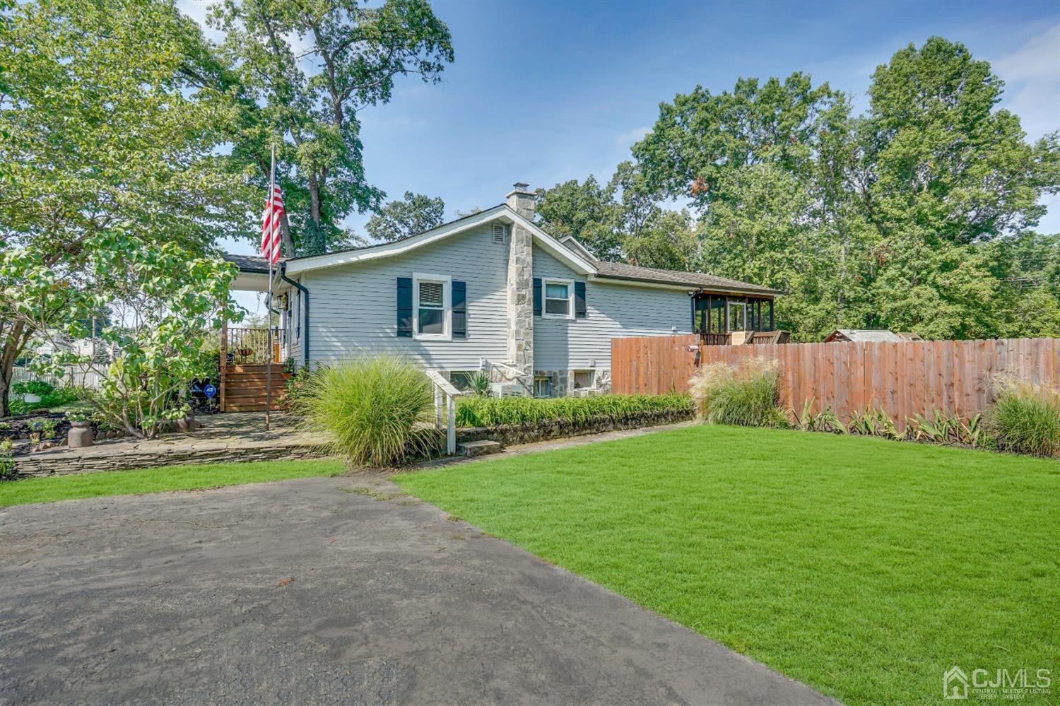 254 Manalapan Road Spotswood, NJ 08884 - Photo 3 of 41 a view of a house with a yard and potted plants